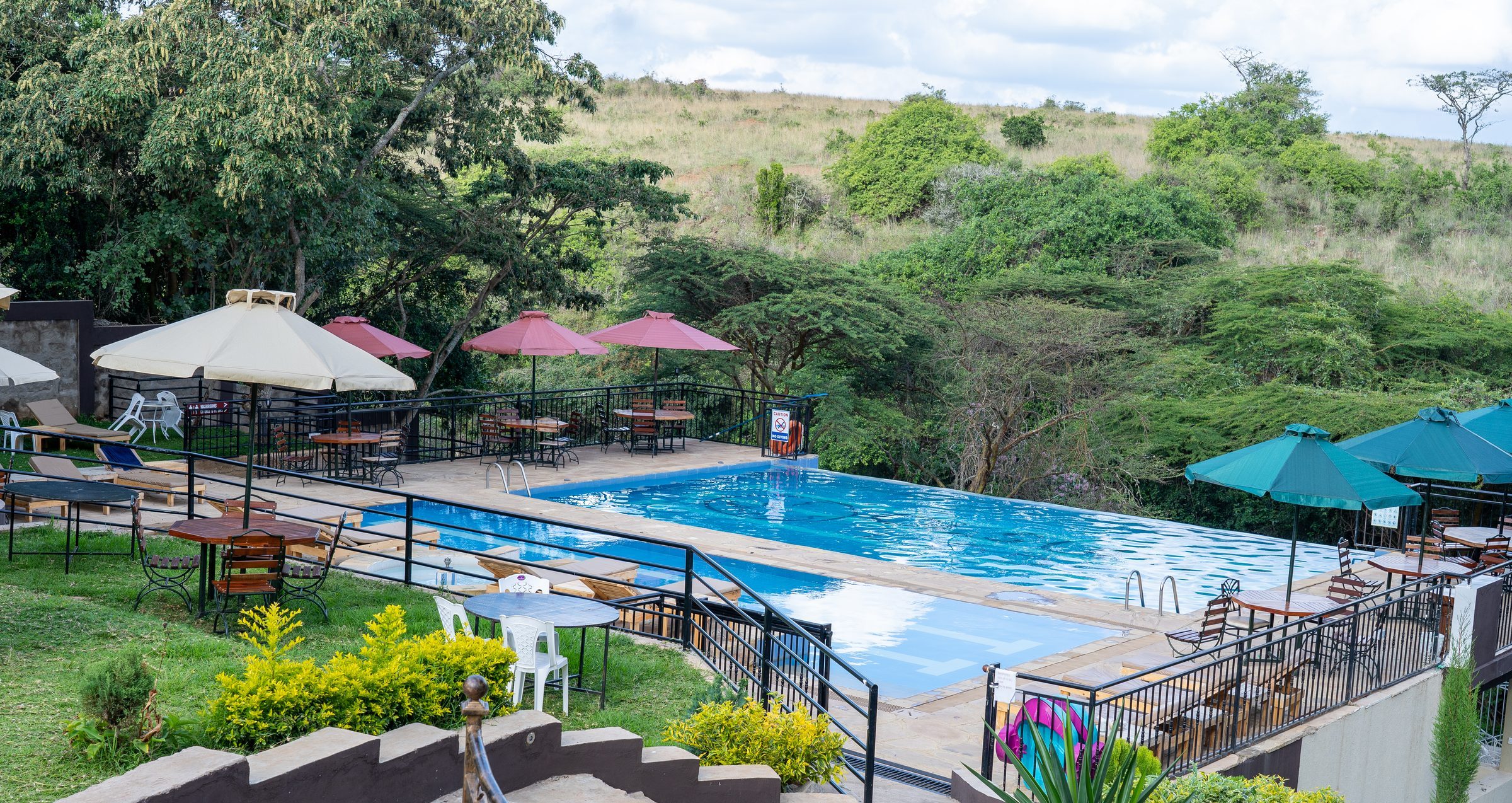 Umbrellas and loungers beside the pool